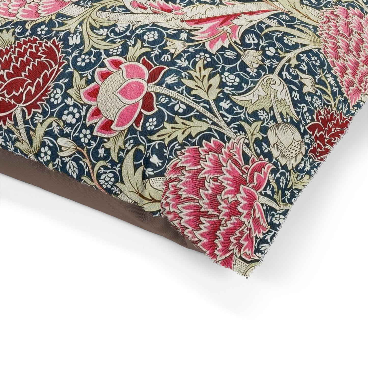 Floral fabric with pink and red flowers on a blue background