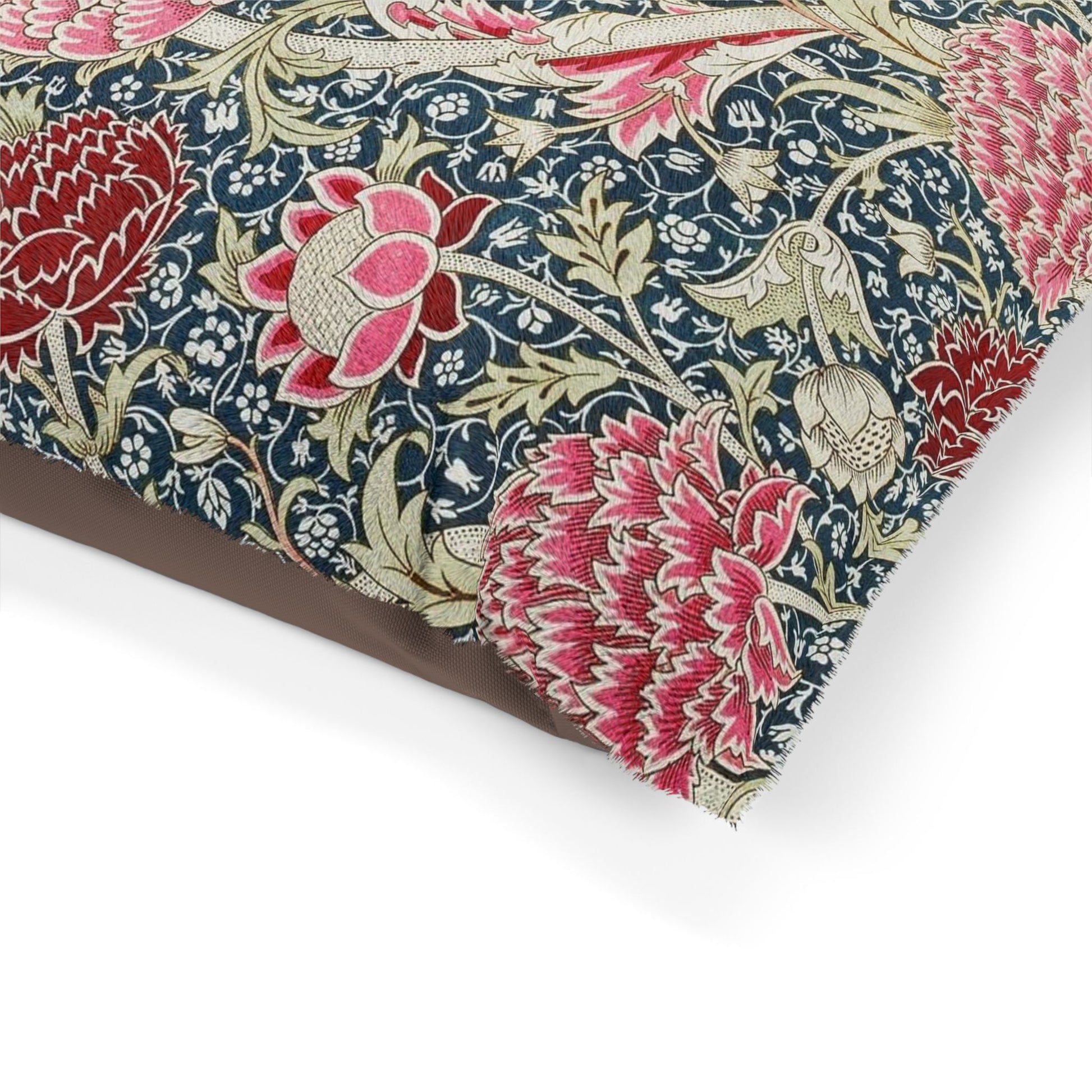 Floral fabric with pink and red flowers on a blue background