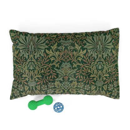 Decorative pillow with a green and brown pattern, accompanied by two dog toys on a white background.