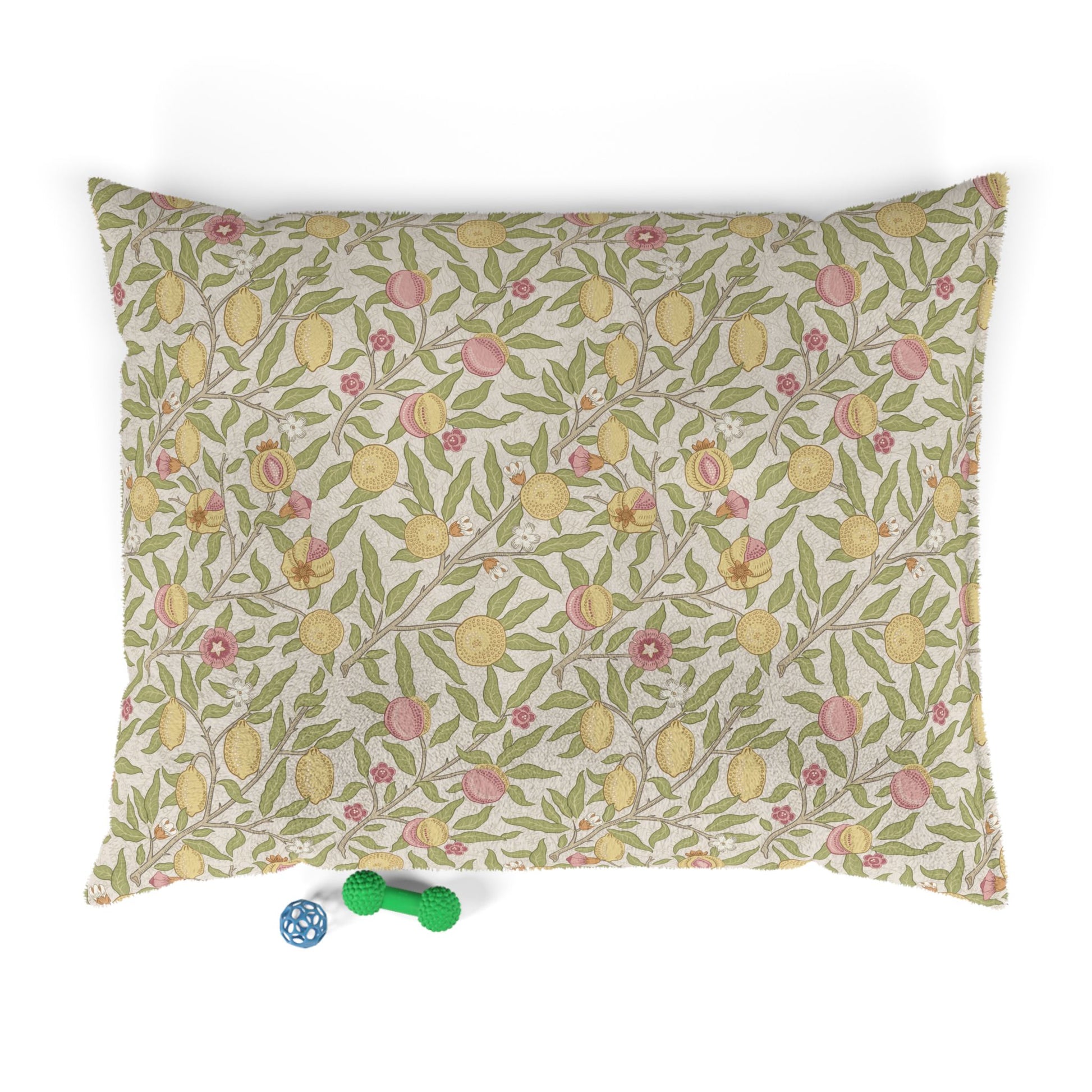 Floral patterned dog bed on a white background with two small toys at the bottom.