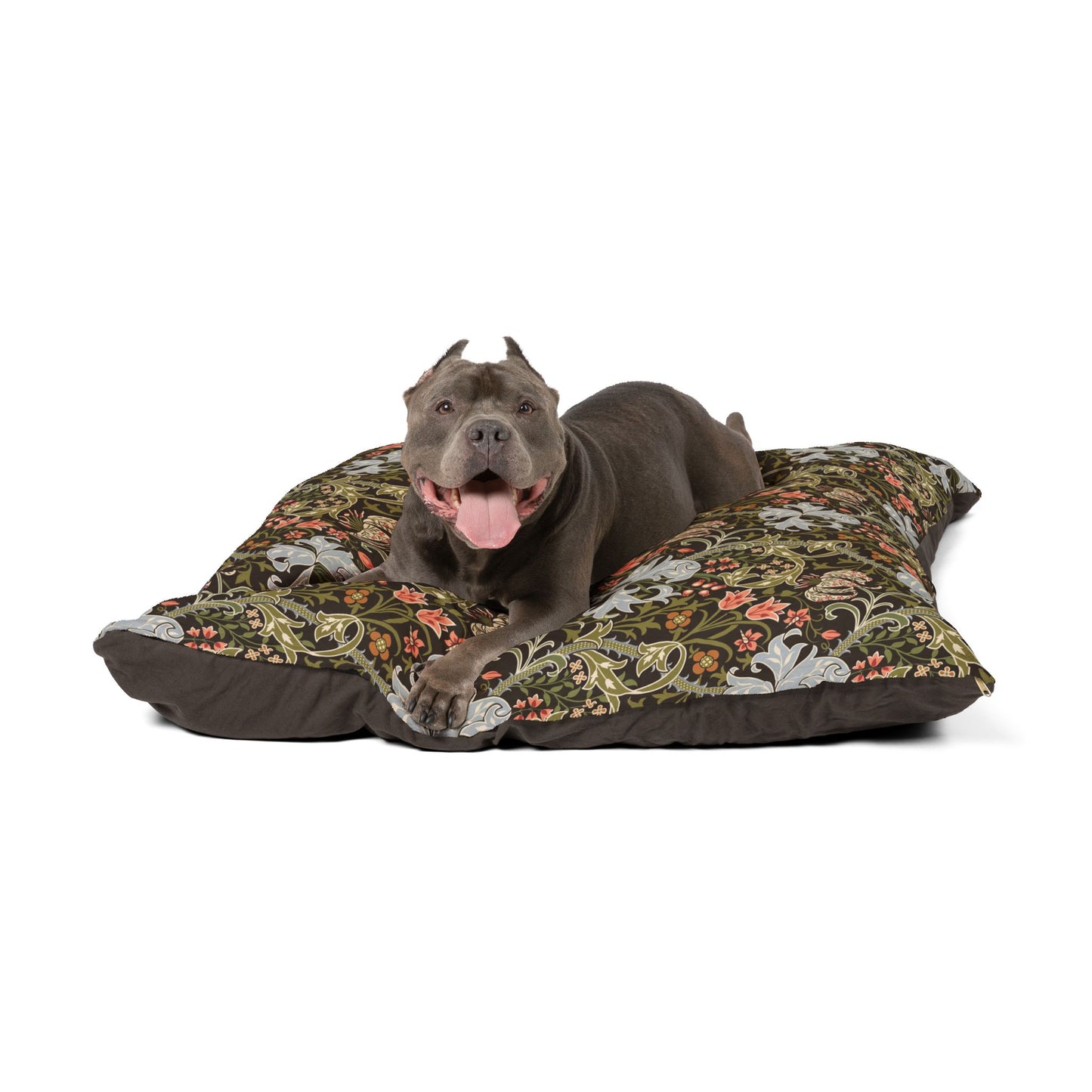 Dog lying on a floral-patterned dog bed with a white background