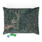 Decorative pillow with nature-themed design featuring a deer and trees, placed on a white surface.