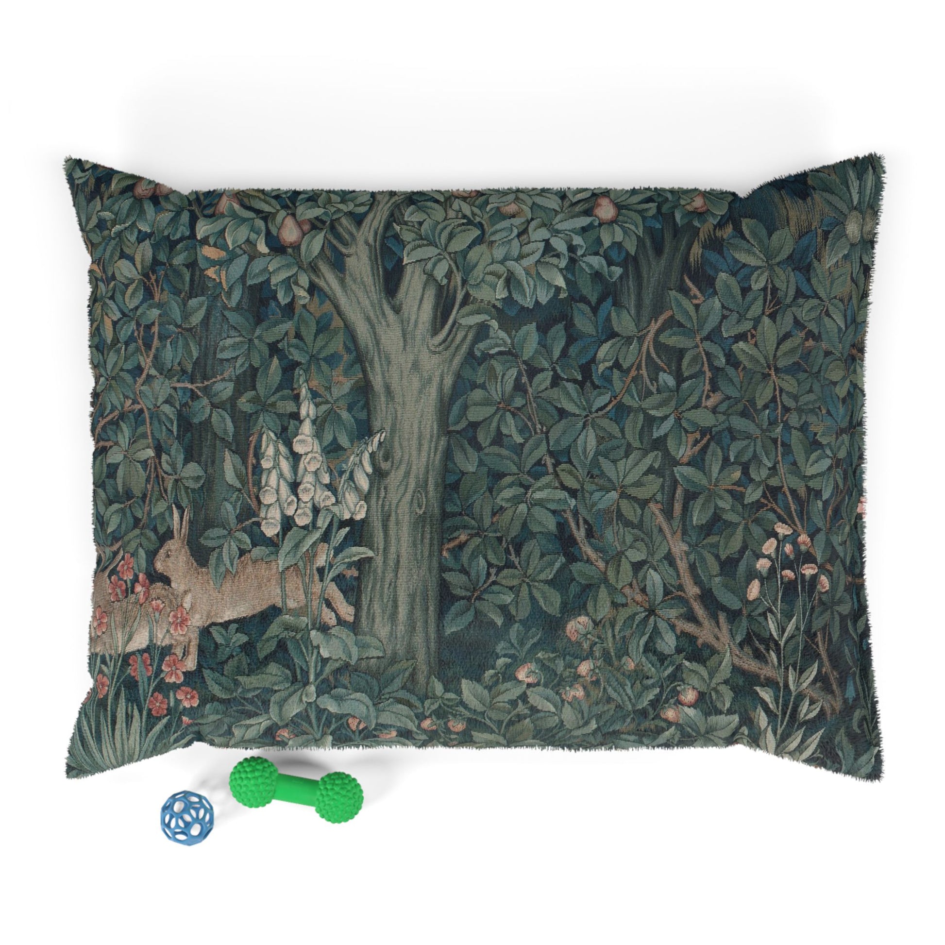 Decorative pillow with nature-themed design featuring a deer and trees, placed on a white surface.