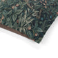 Close-up of a fabric with a nature-themed pattern on a white background