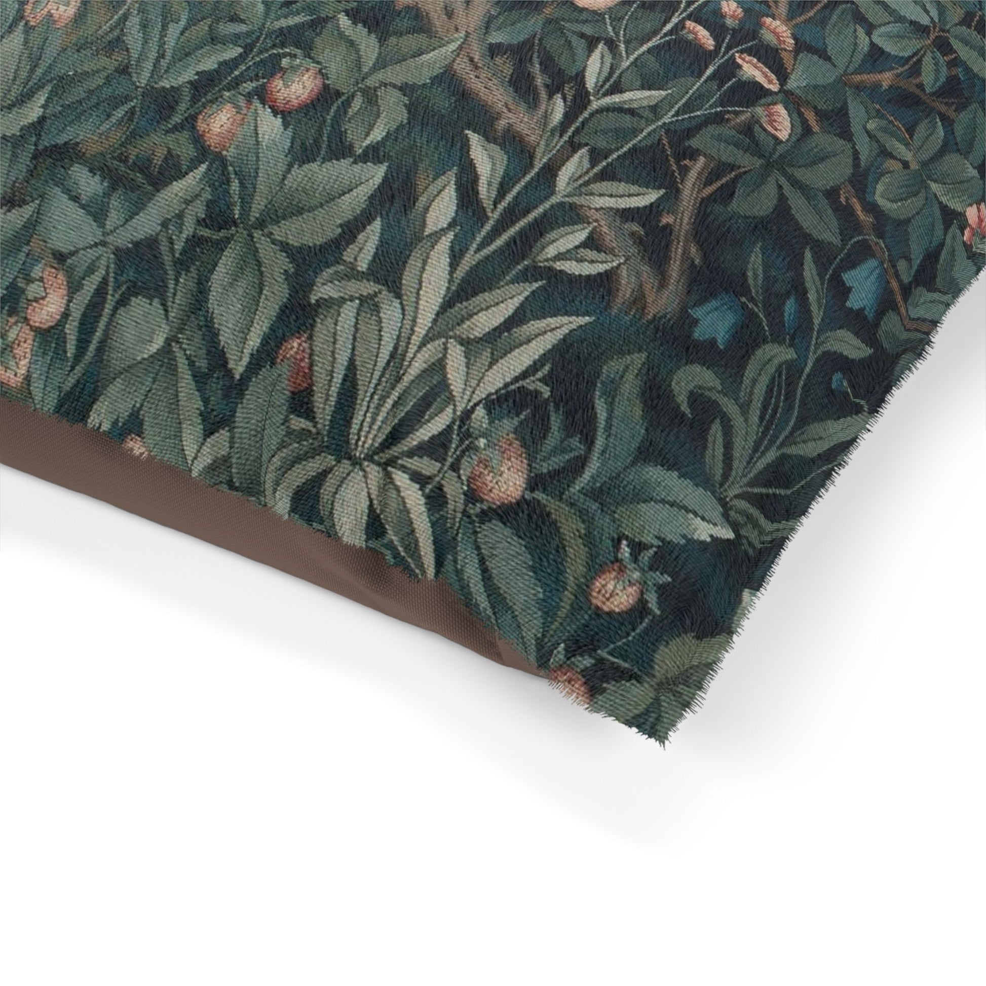 Close-up of a fabric with a nature-themed pattern on a white background