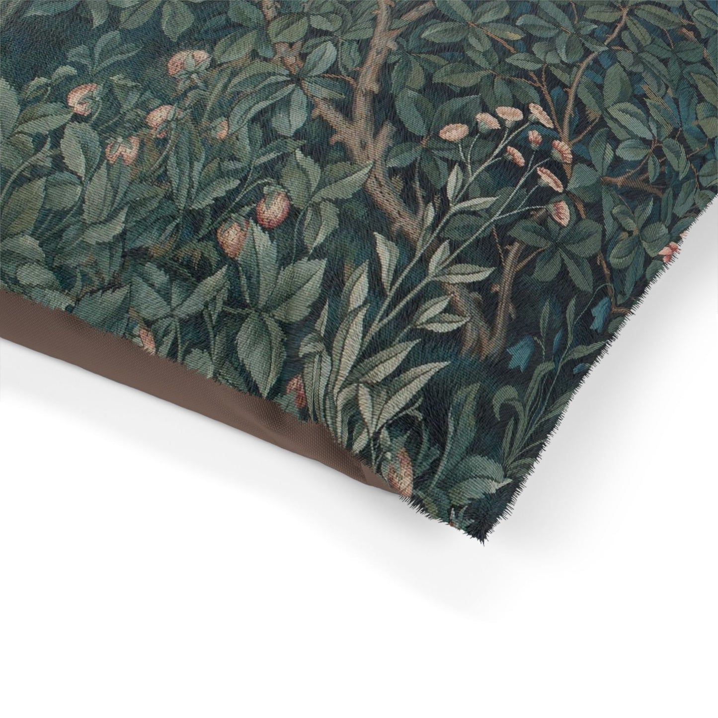 Close-up of a floral patterned fabric with green leaves and brown branches on a white background