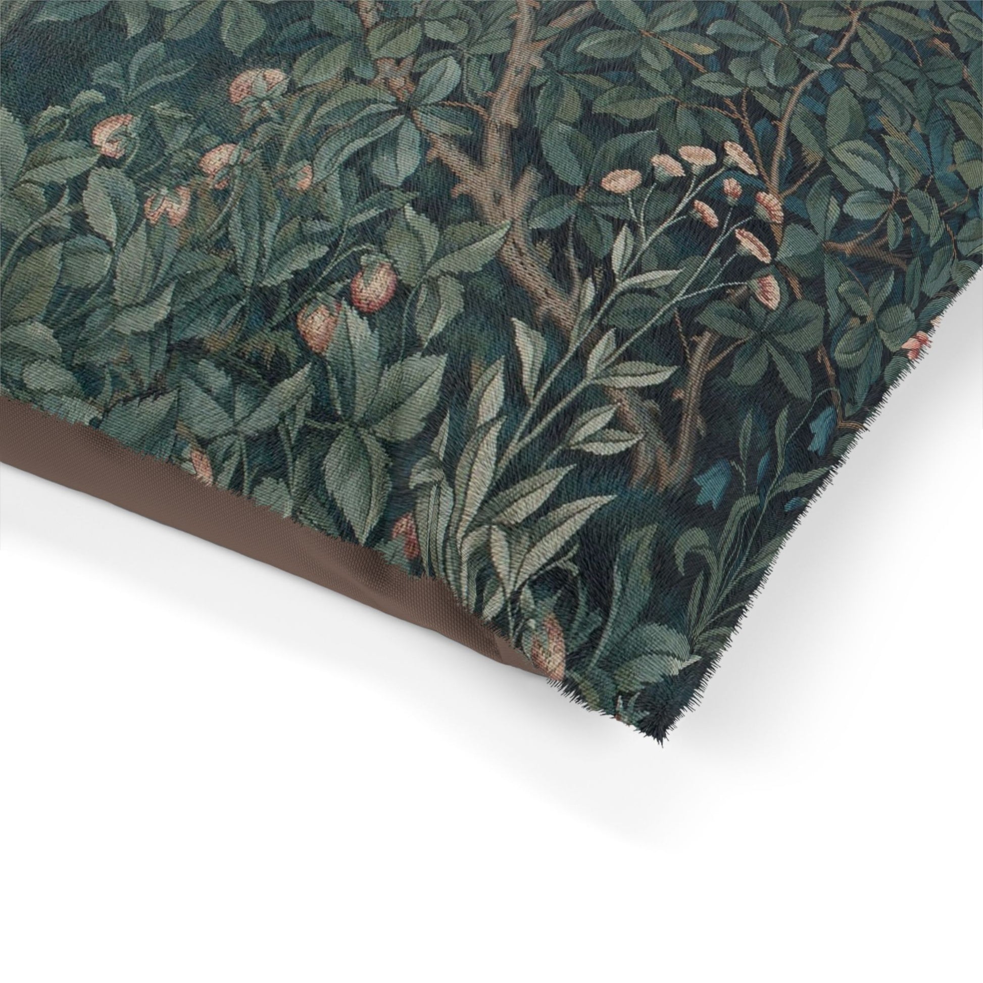 Close-up of a floral patterned fabric with green leaves and brown branches on a white background
