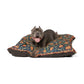 Dog lying on a decorative pet bed with a white background