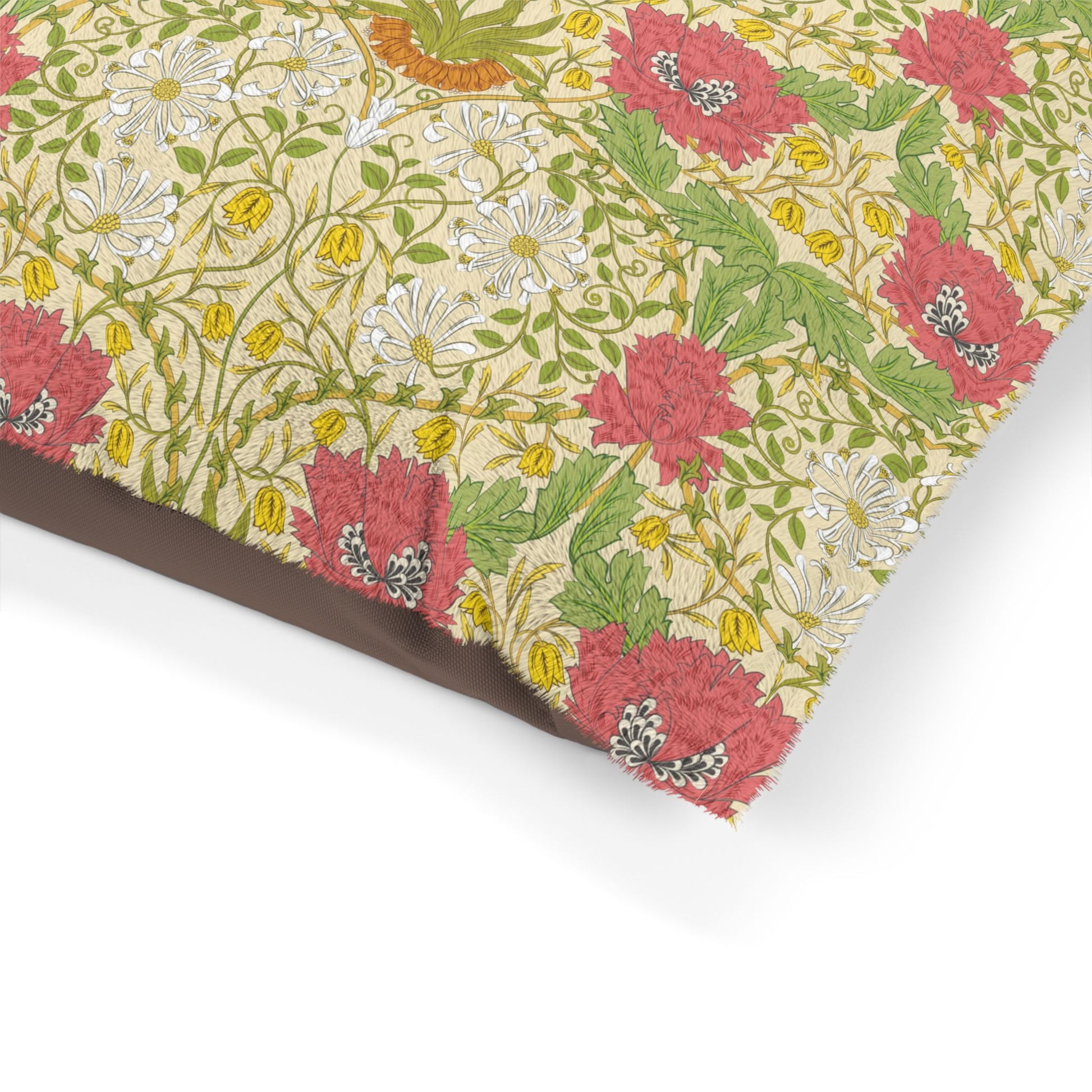 Floral patterned fabric with pink, green, and yellow flowers on a beige background.