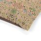 Floral patterned paper with green and blue flowers on a pink background