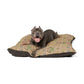 Dog lying on a floral-patterned pet bed with a white background