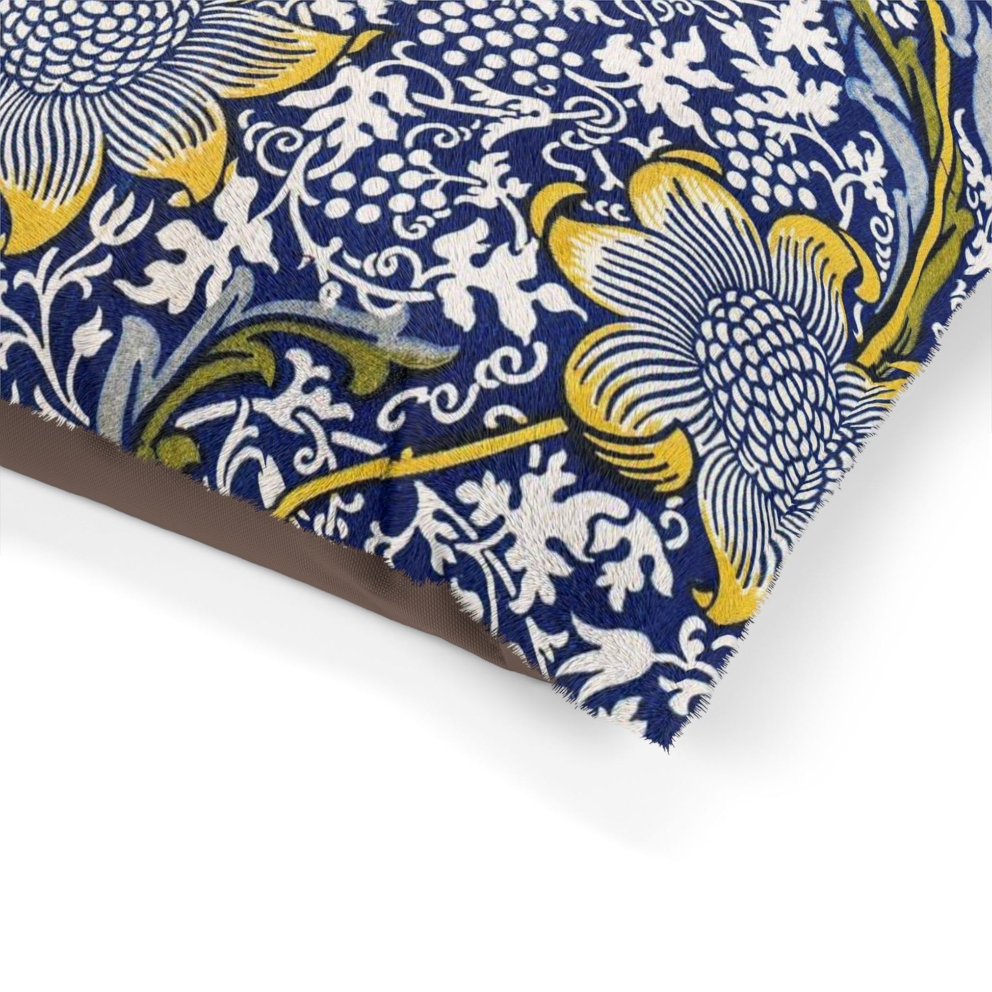 Close-up of a floral patterned fabric with blue, yellow, and white colors on a white background.
