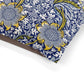 Fabric with blue and yellow floral pattern on a white background