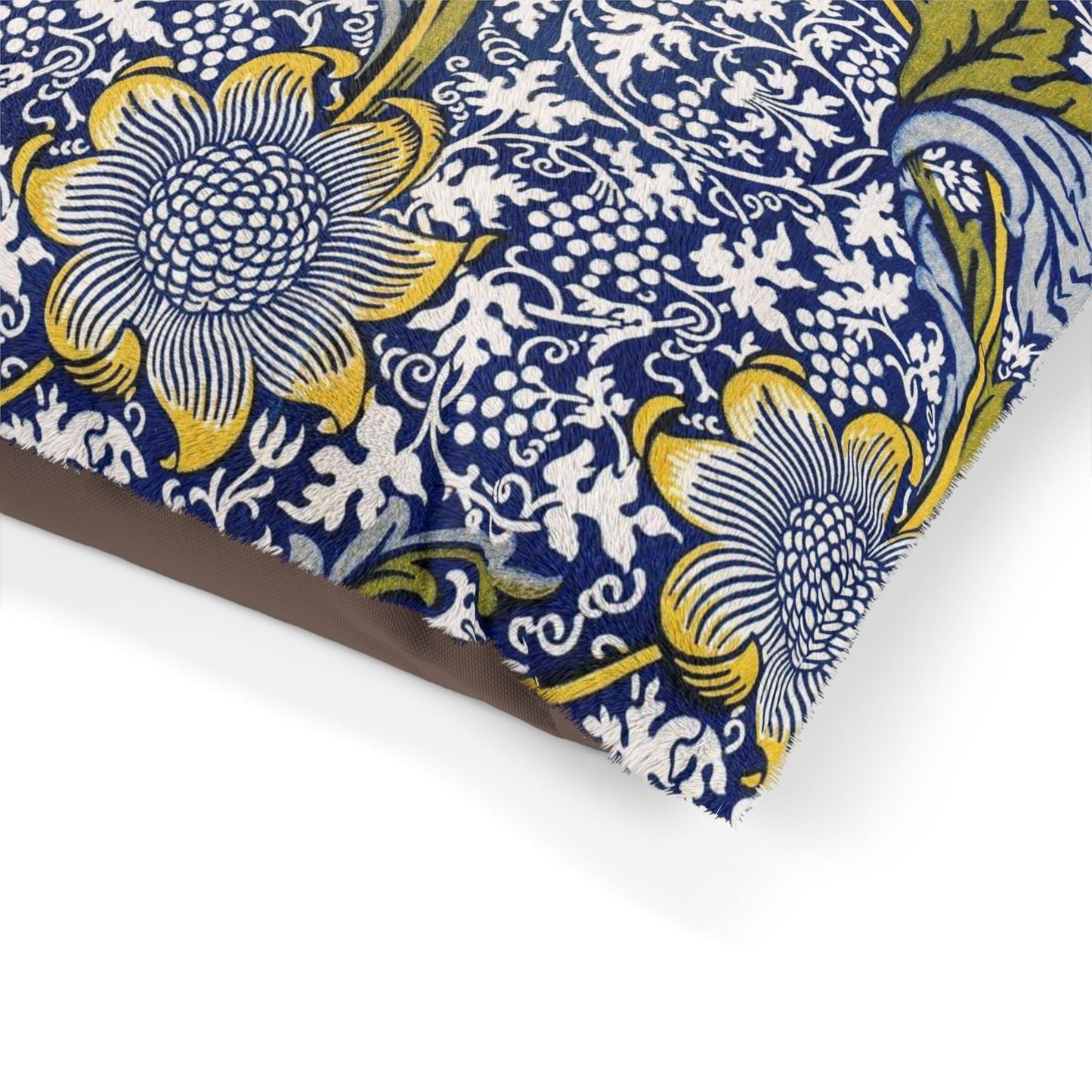 Floral patterned fabric with blue, yellow, and white colors on a white background
