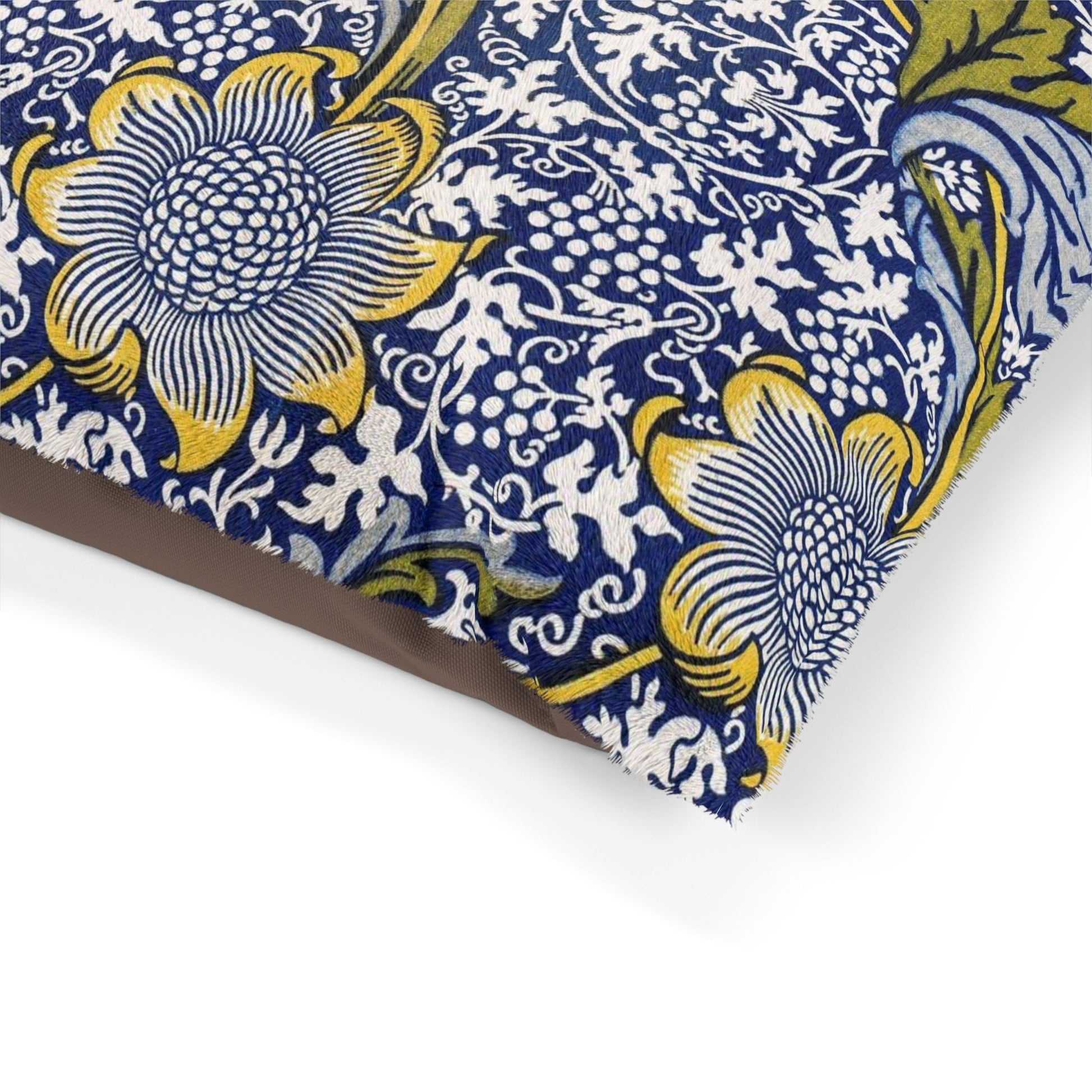 Floral patterned fabric with blue, yellow, and white colors on a white background