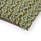 Floral and leaf patterned fabric on a white background
