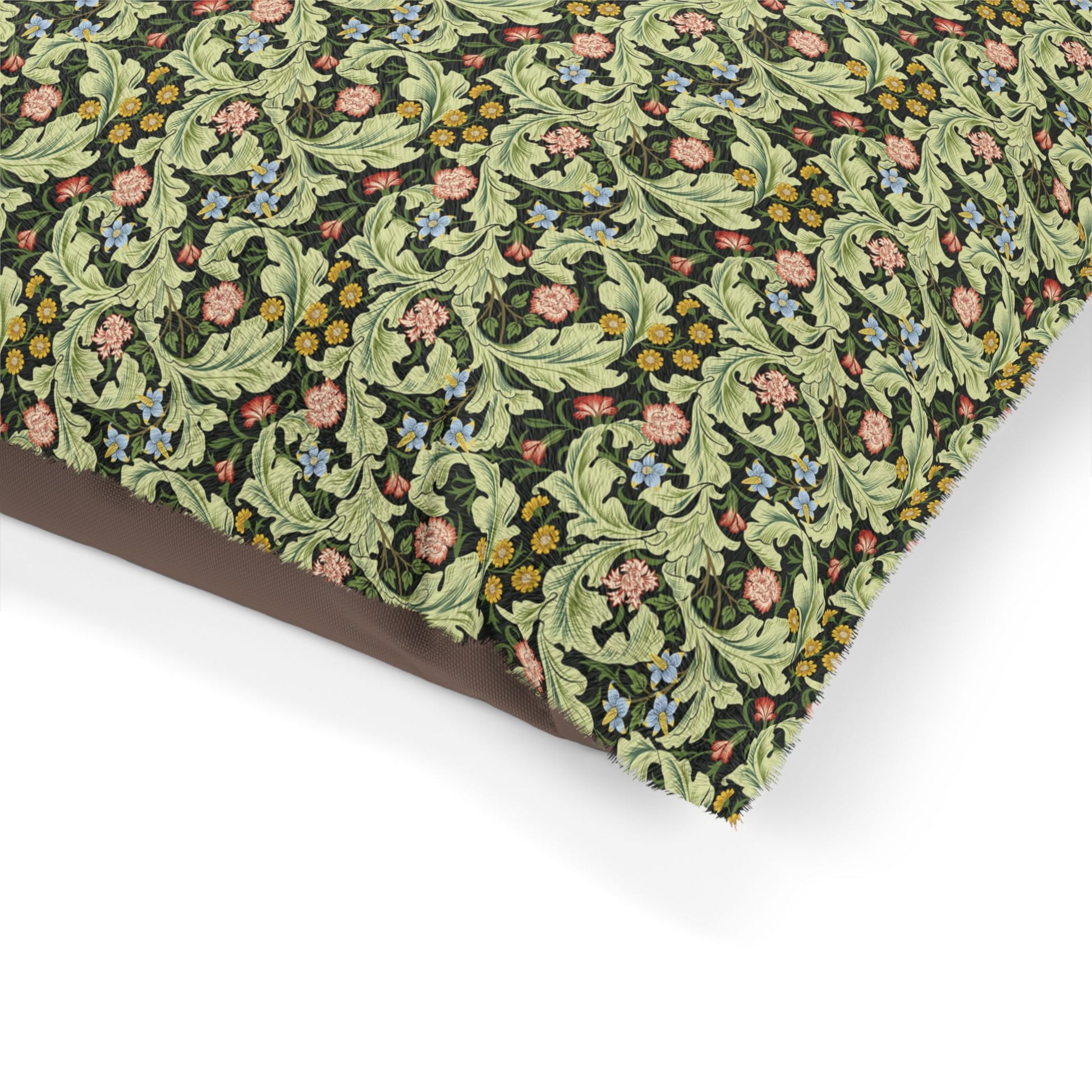 Floral and leaf patterned fabric on a white background