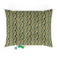 Floral-patterned pet bed with two dog toys on a white background