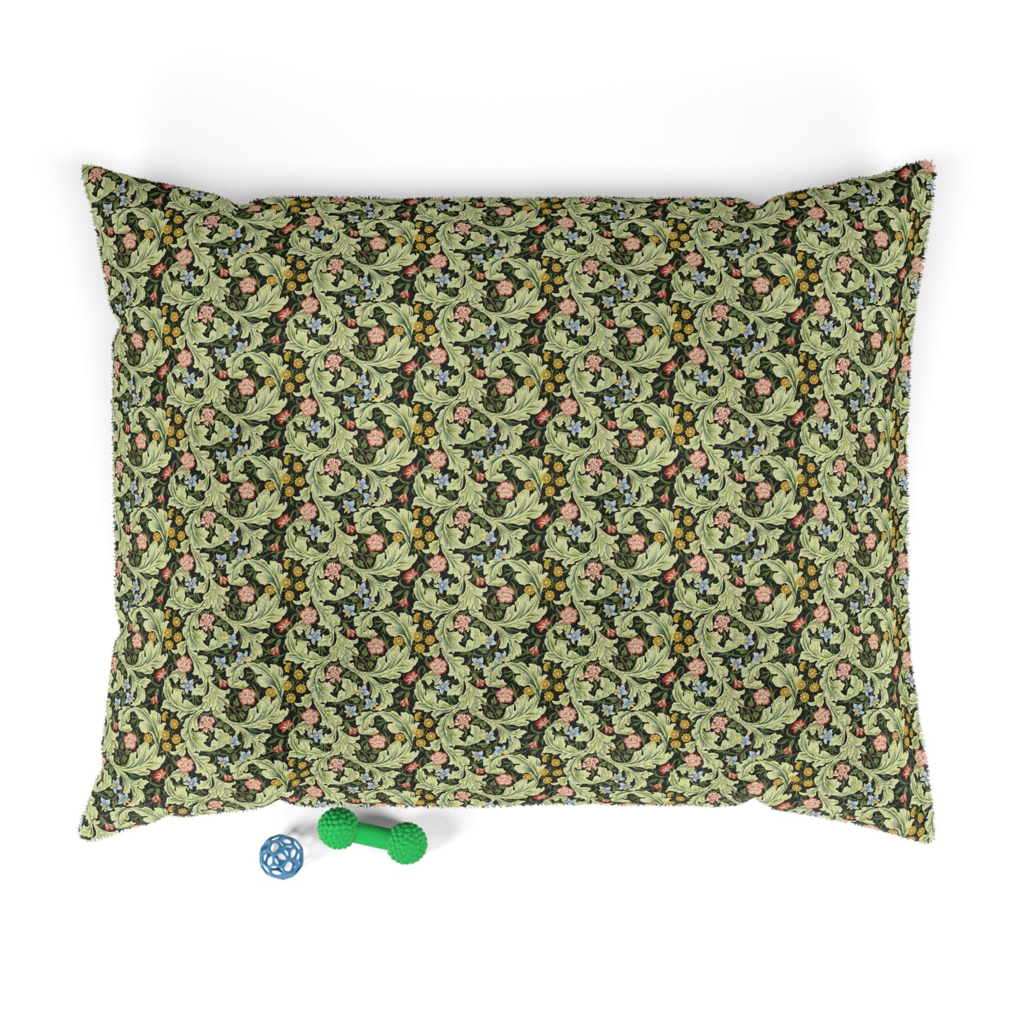 Floral-patterned pet bed with two dog toys on a white background