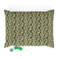 Floral patterned pillowcase on a white background with a green dog toy below.