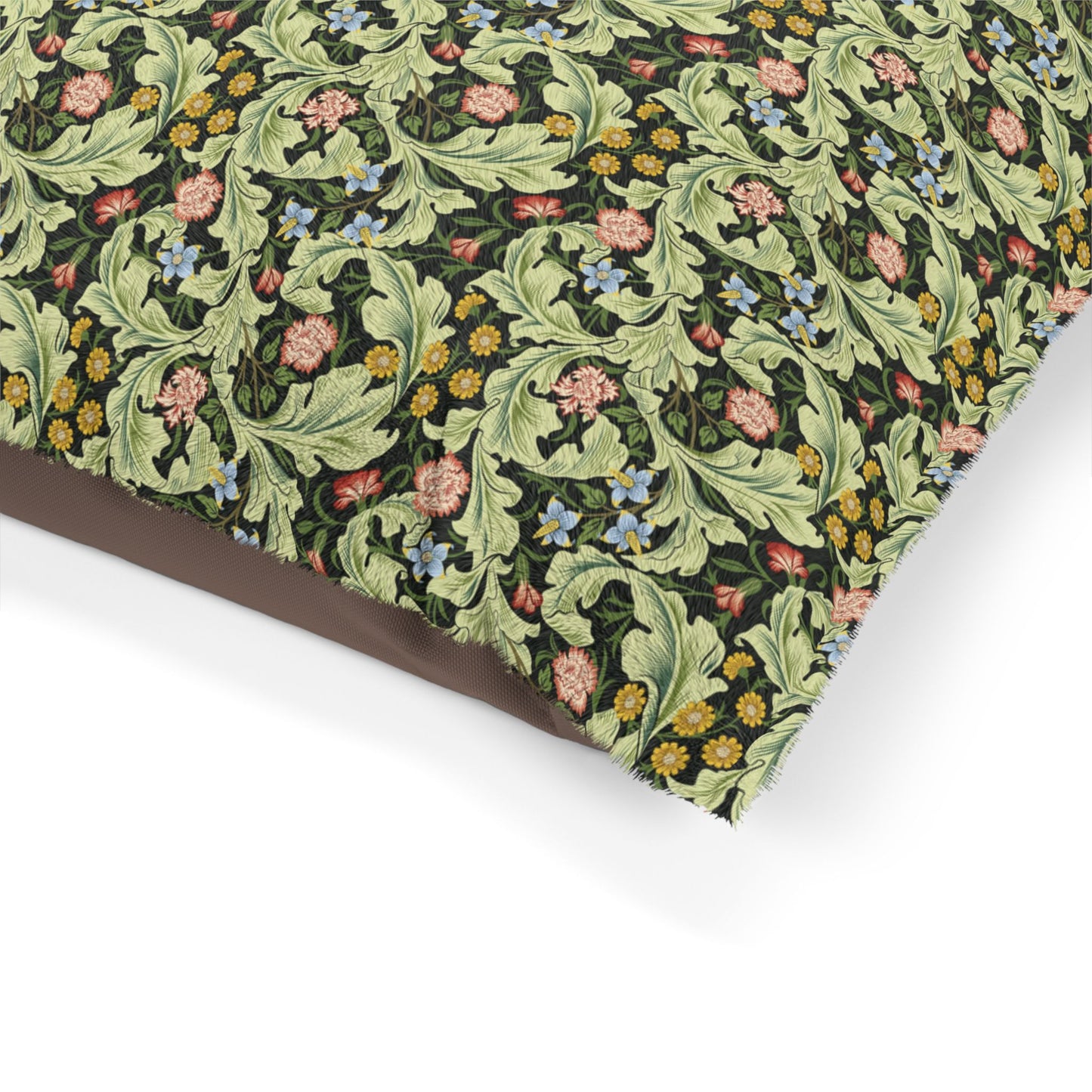 Floral and leaf patterned fabric on a white background