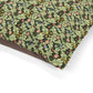 Floral and leaf patterned fabric on a white background
