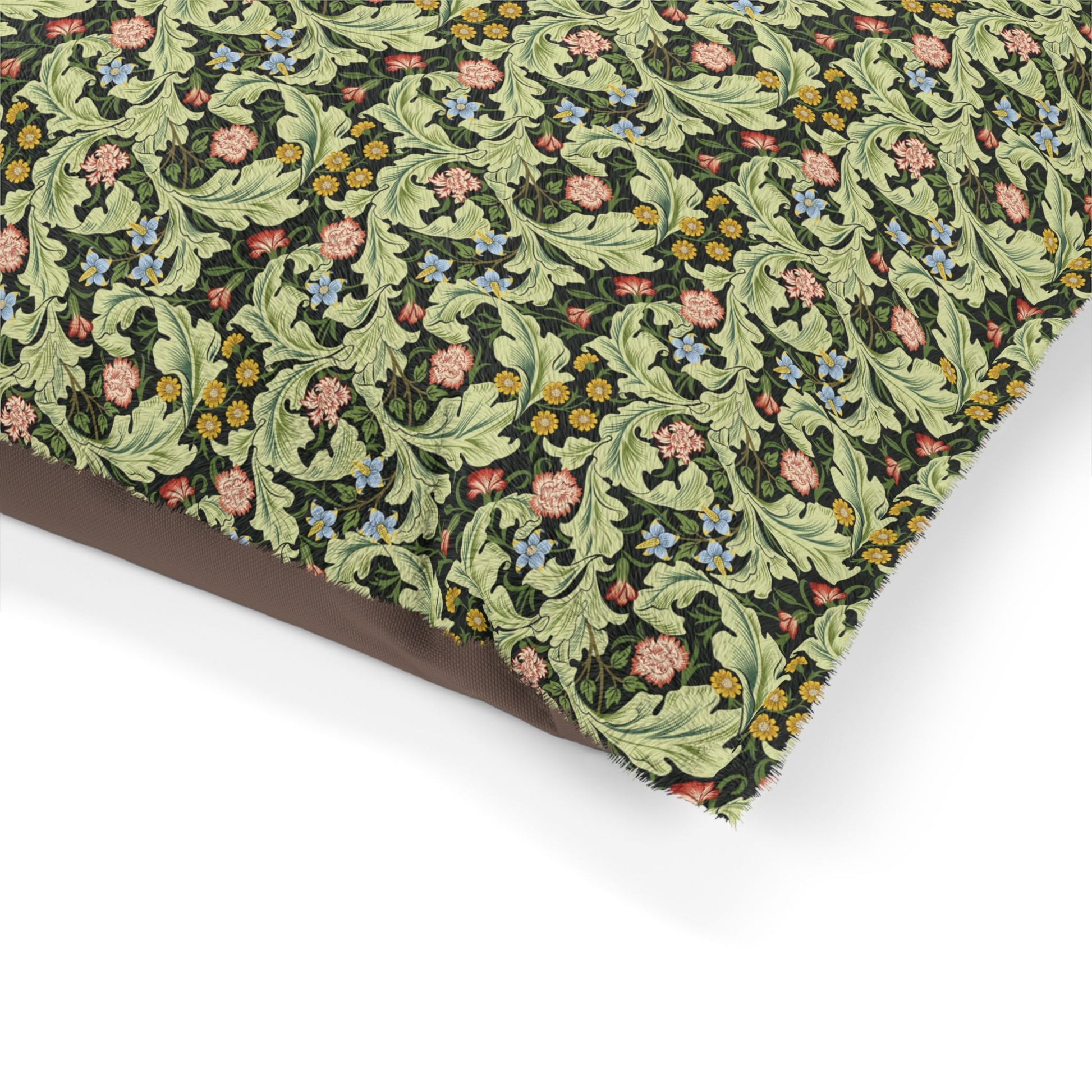 Floral and leaf patterned fabric on a white background