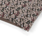 Close-up of a fabric with intricate floral pattern on a white background