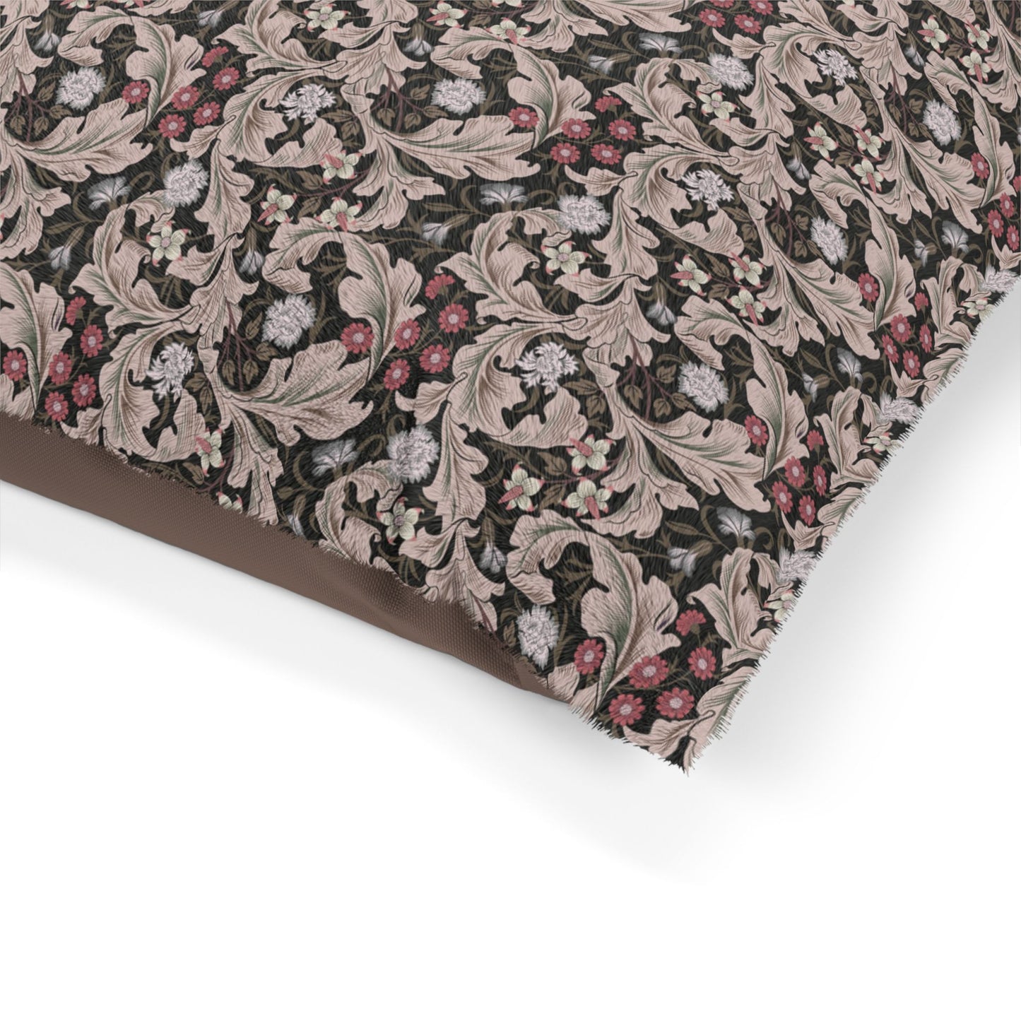 Close-up of a fabric with intricate floral pattern on a white background