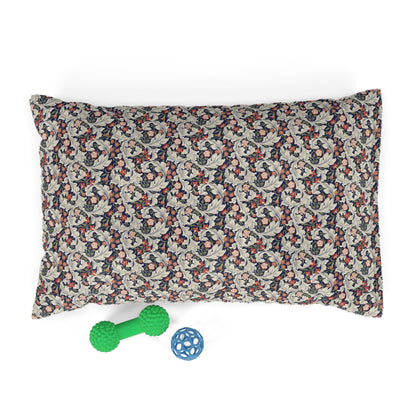 Floral-patterned pet bed with a green bone-shaped toy and blue ball on a white background