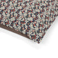 Floral and leaf patterned fabric on a white background