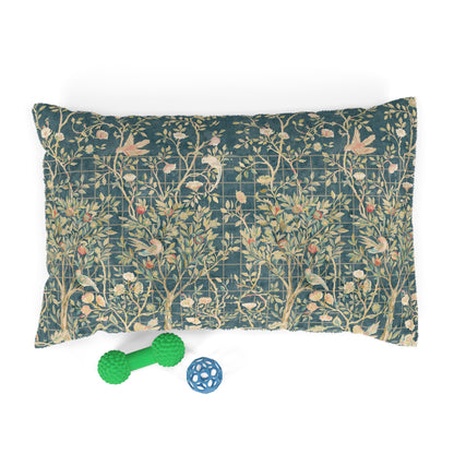 Decorative dog pillow with William Morris & Co floral pattern and two pet toys on a white background