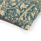 Decorative dog pillow with William Morris & Co floral and bird pattern on a white background