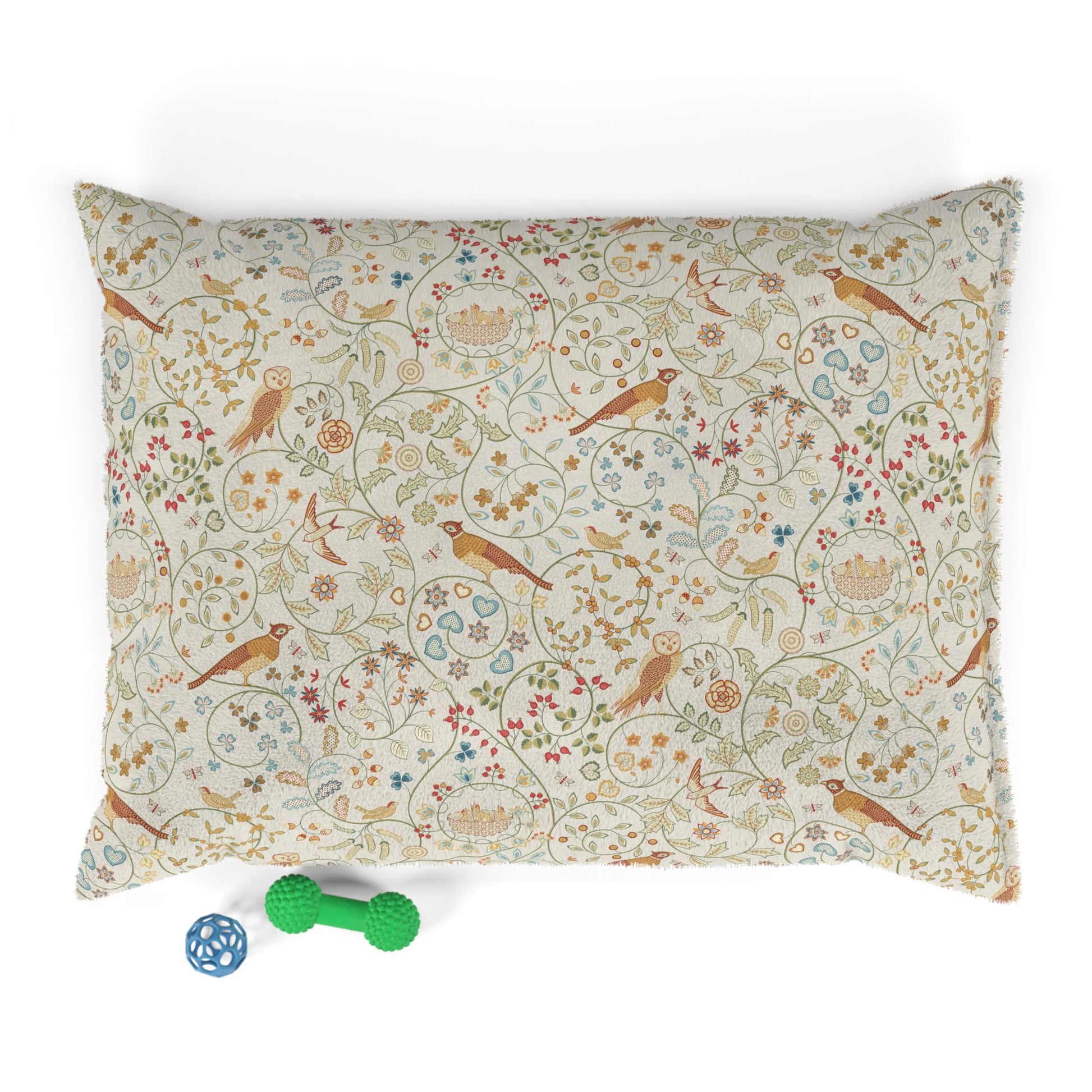 Decorative pillow with bird and floral pattern on a white background