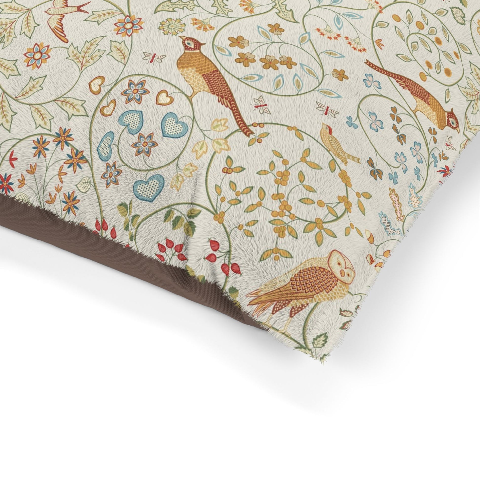 Patterned fabric with birds and floral designs on a white background