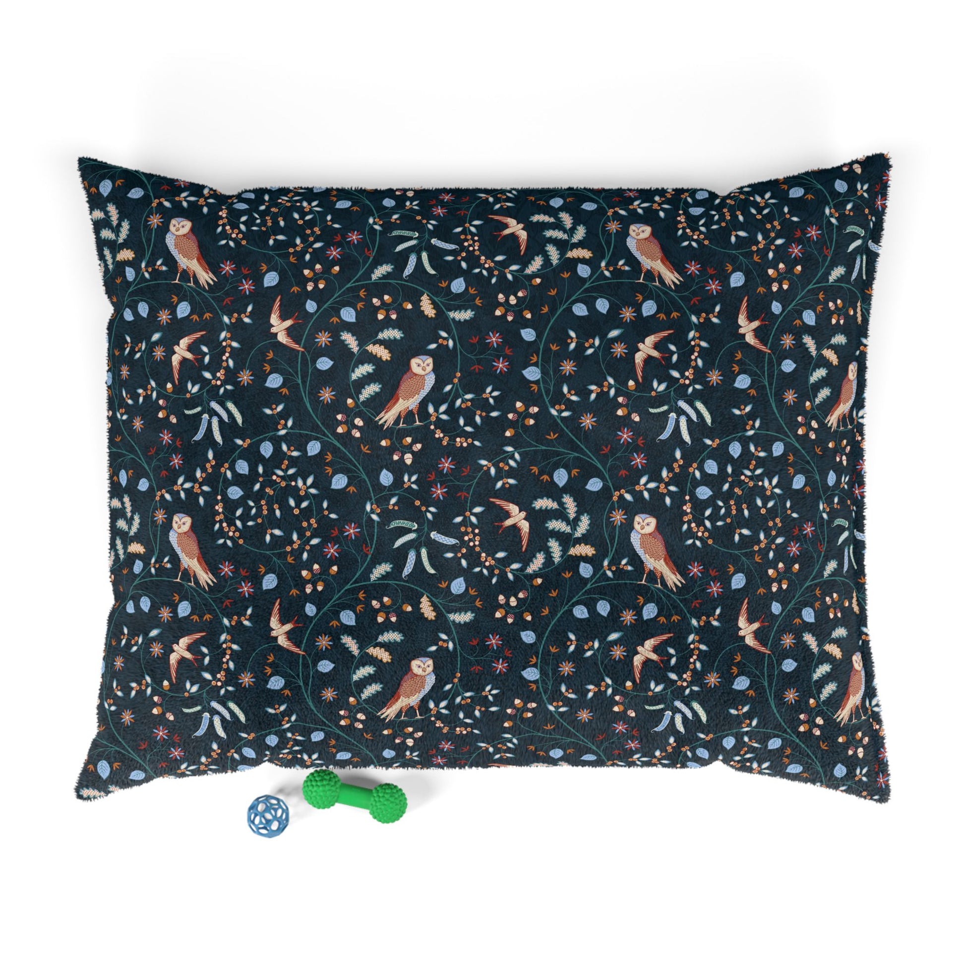 Decorative pillow with bird and floral pattern on a white background