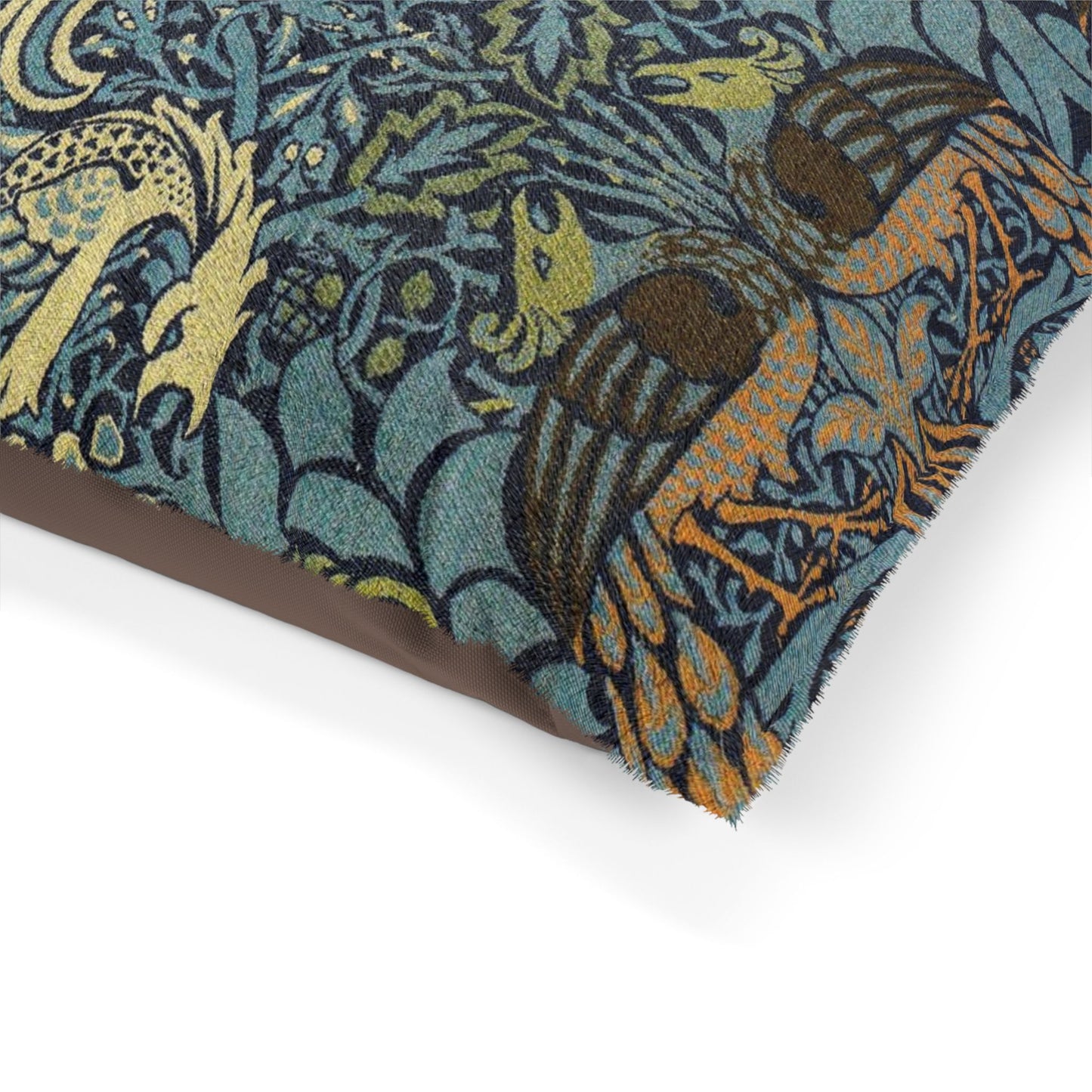 Decorative fabric with intricate patterns of birds and foliage on a teal background.