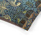 Patterned fabric with birds and foliage on a white background
