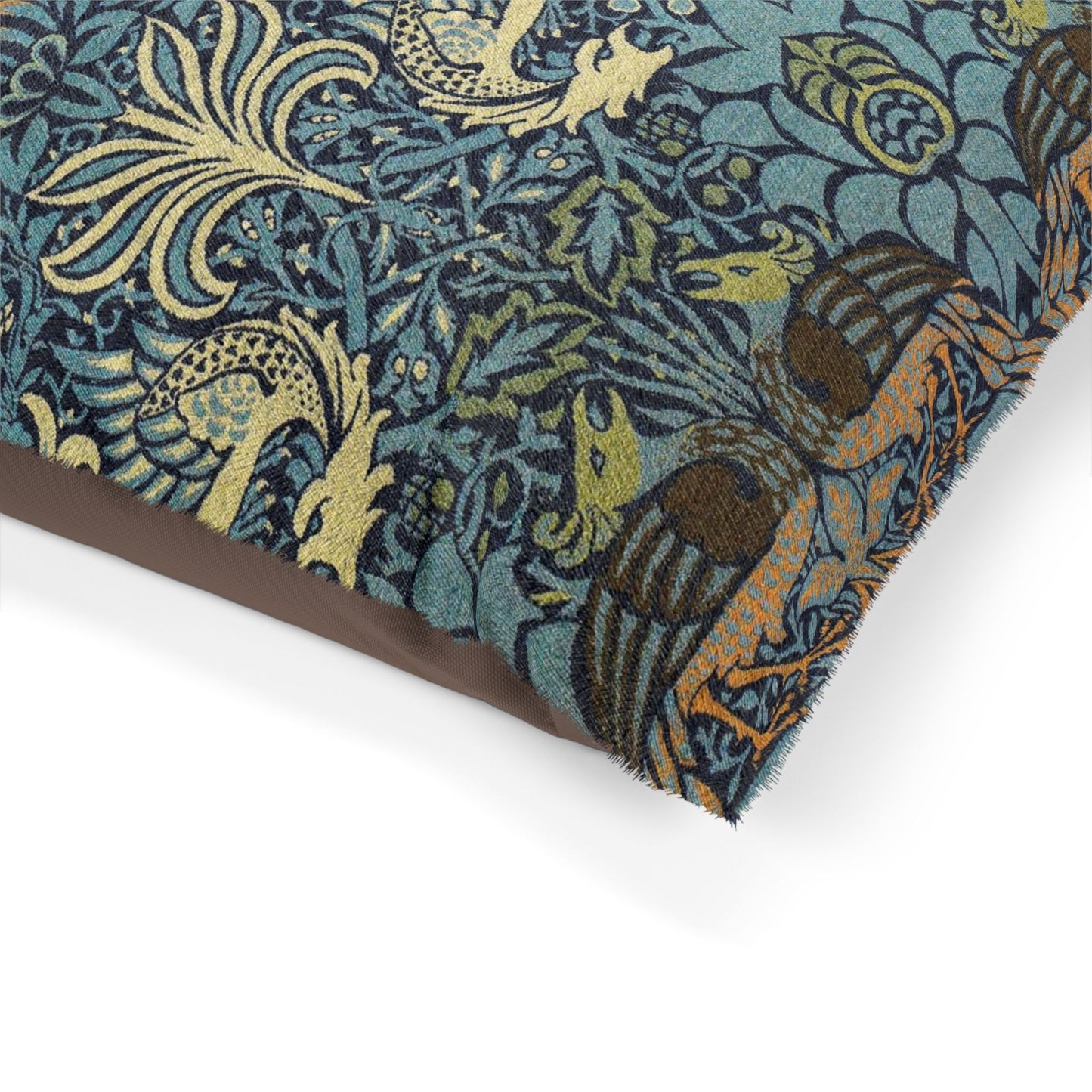 Close-up of a patterned fabric with birds and foliage on a white background