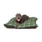 Dog lying on a green William Morris & Co floral-patterned dog bed with a white background