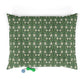 Green dog pillow with white floral William Morris & Co pattern on a white background