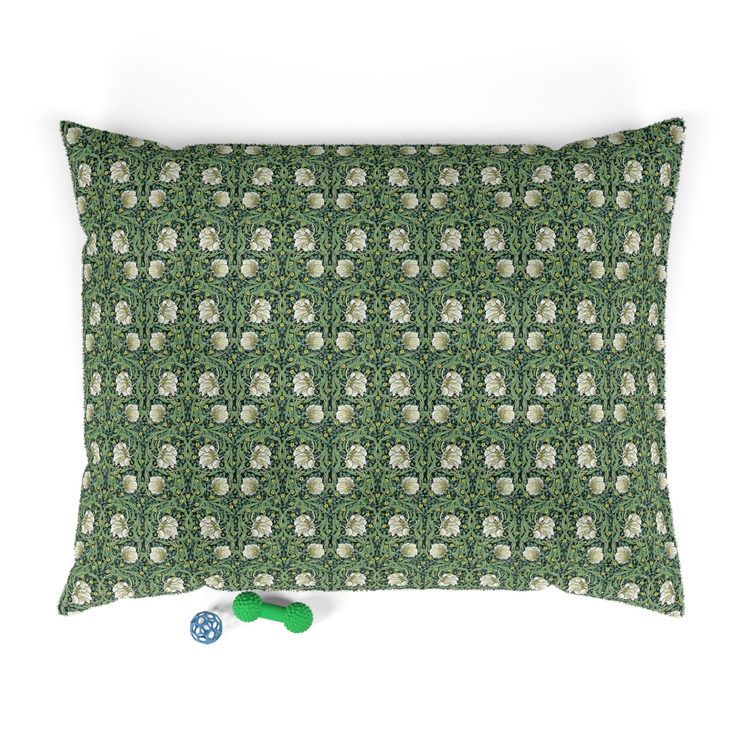 Green dog pillow with white floral William Morris & Co pattern on a white background
