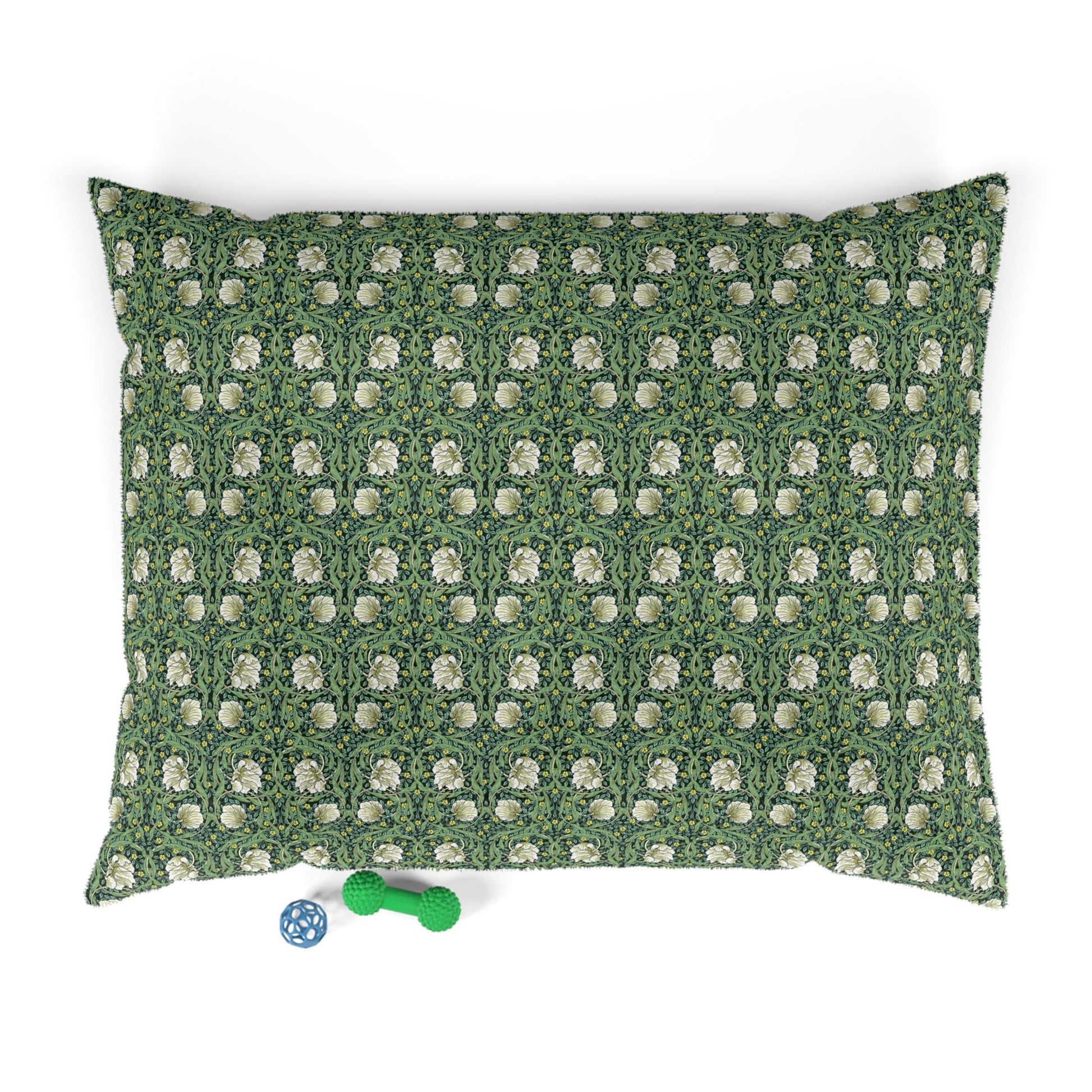 Green dog pillow with white floral William Morris & Co pattern on a white background