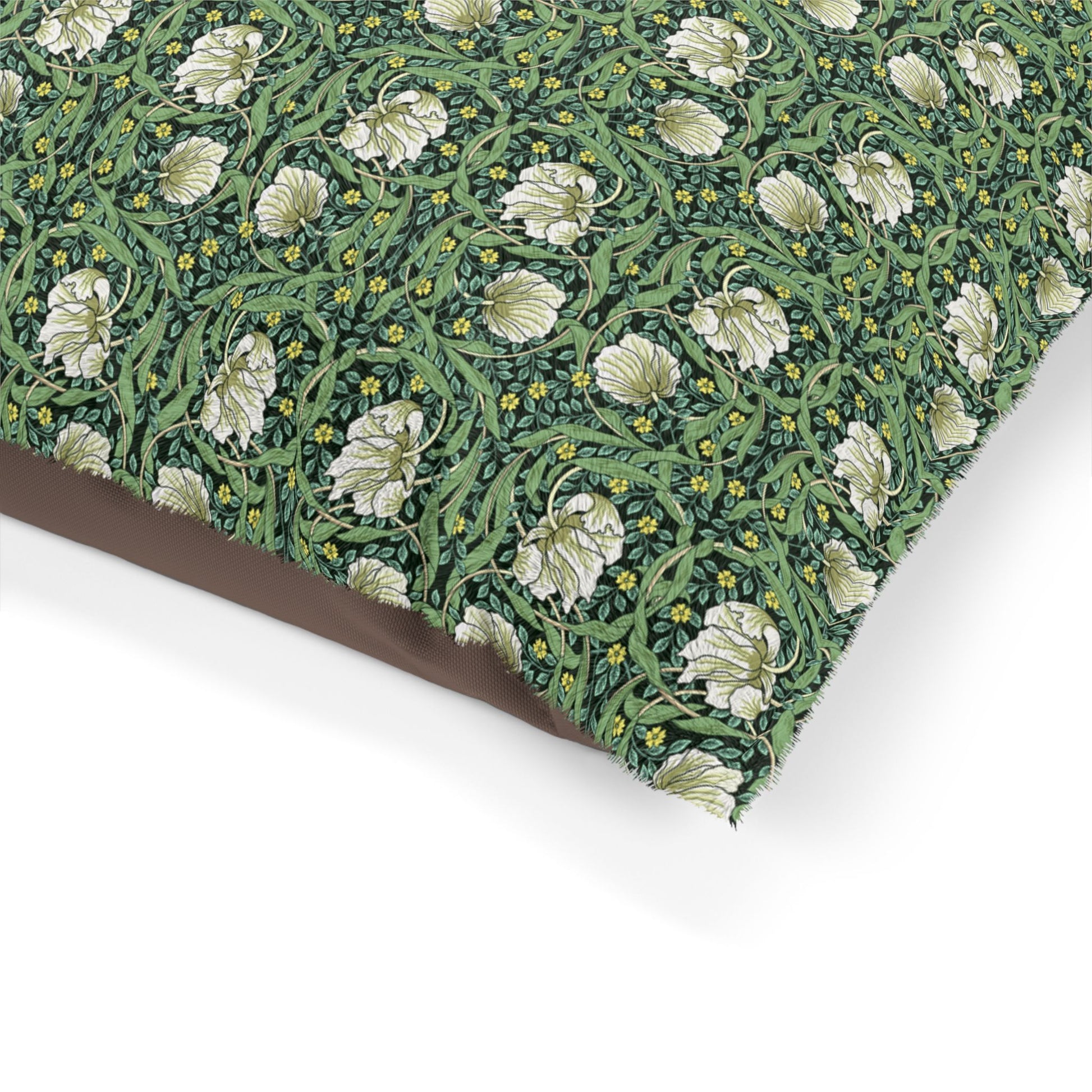 Floral patterned dog pillow with green leaves and white flowers on a white background
