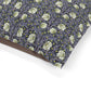 Floral William Morris & Co patterned fabric with green leaves on a purple background