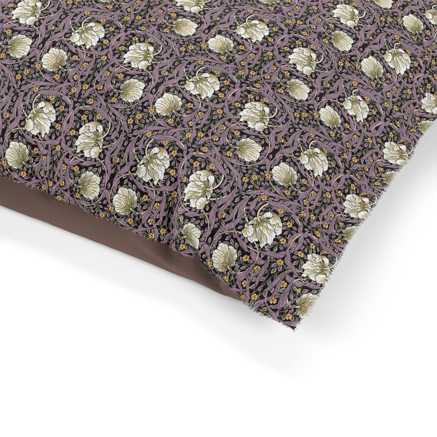 Floral patterned fabric with a purple background on a white surface