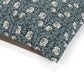 Floral patterned fabric with a brown border on a white background