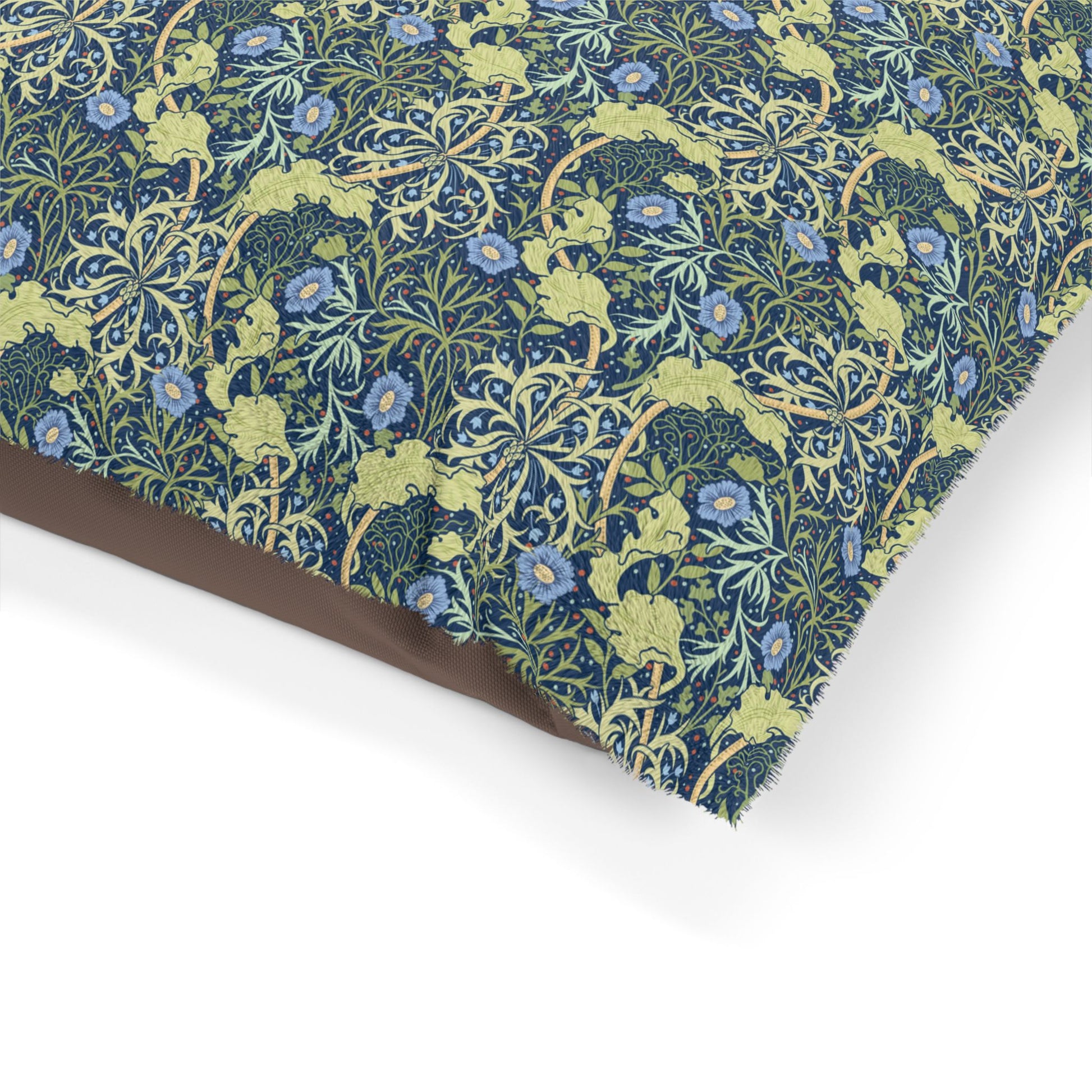 Floral patterned fabric with blue flowers and green leaves on a white background