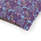 Floral patterned fabric with purple, blue, and pink colors on a white background