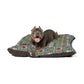 Dog lying on a floral-patterned dog bed with a white background